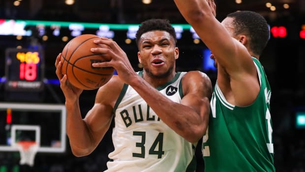 Dec 13, 2021; Boston, Massachusetts, USA; Milwaukee Bucks forward Giannis Antetokounmpo (34) drives to the basket defended by Boston Celtics forward Grant Williams (12) during the second half at TD Garden. Mandatory Credit: Paul Rutherford-USA TODAY Sports